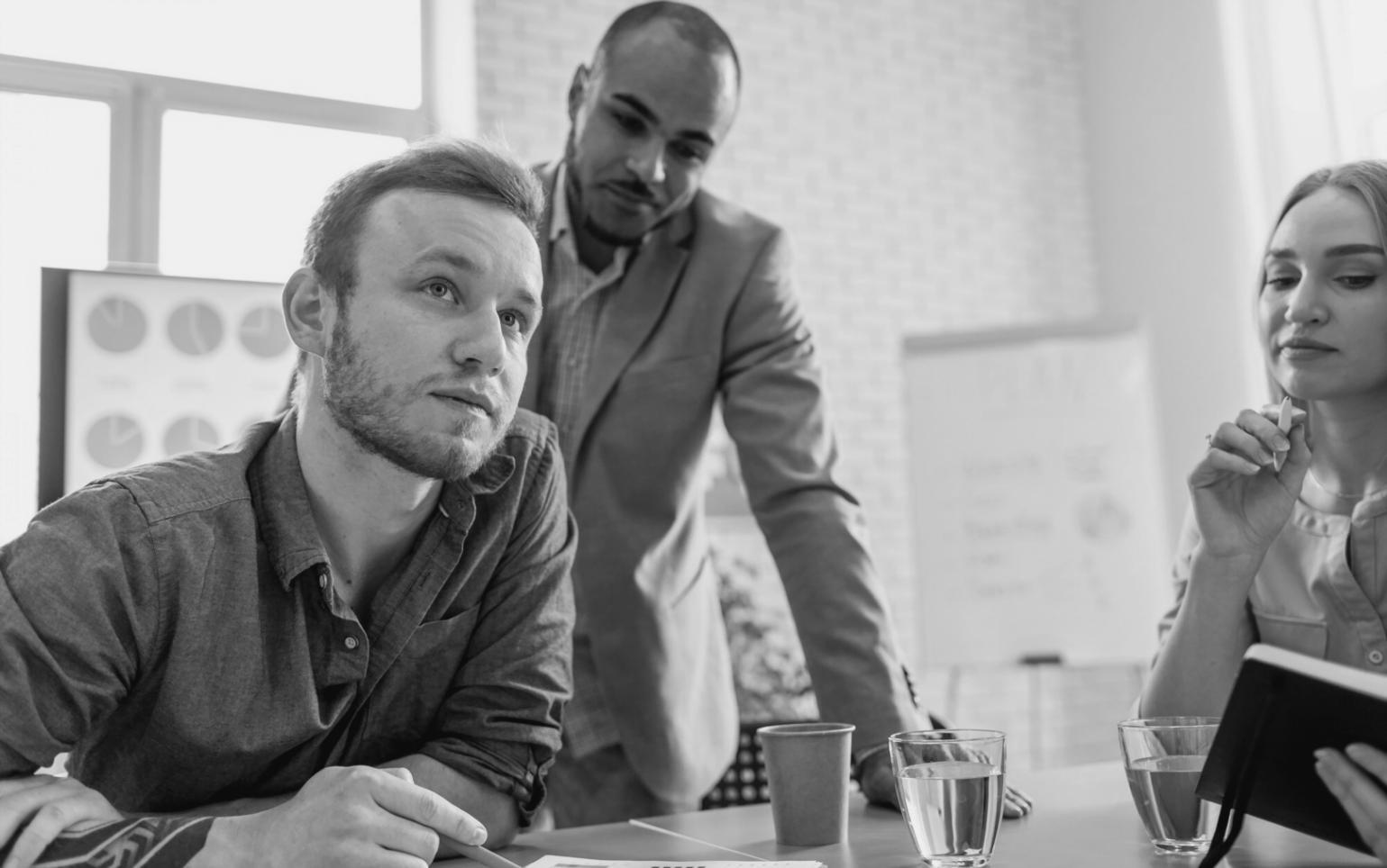 Team reviewing compliance reports and analytics